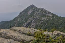A shot of Mt Chocorua as seen from Middle Sister, with a section of ridge running across the lower frame.
