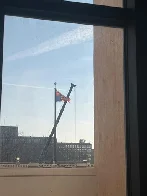 Flag flown upside down as sign of distress outside of US State Department building today