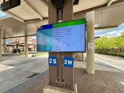 An outdoor bus tracking monitor at the Bloomington Transit Station