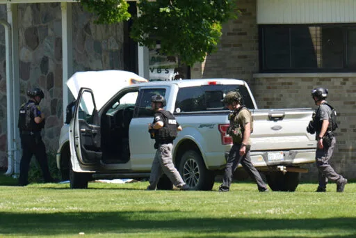 Gunman killed after shooting into Michigan church, where his mother is a member