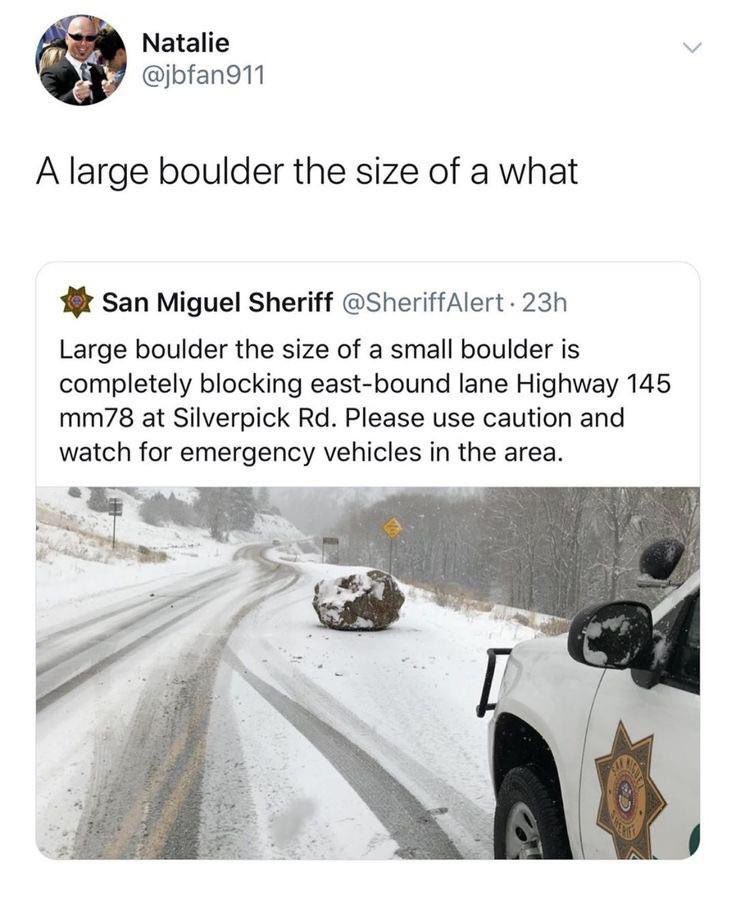 Large boulder the size of a small boulder is blocking the highway.