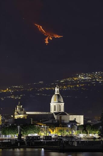 Eruption on Mount Etna (Sicily) giving the illusion of a Phoenix in the sky