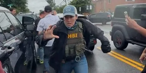 ICE Agent Fled From Angry Residents Outside New York School — and Got in a Car Crash