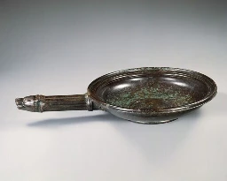 Bronze Roman pan with wolf-head handle, 1st century AD