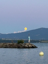 The moon balancing on the mountain. 