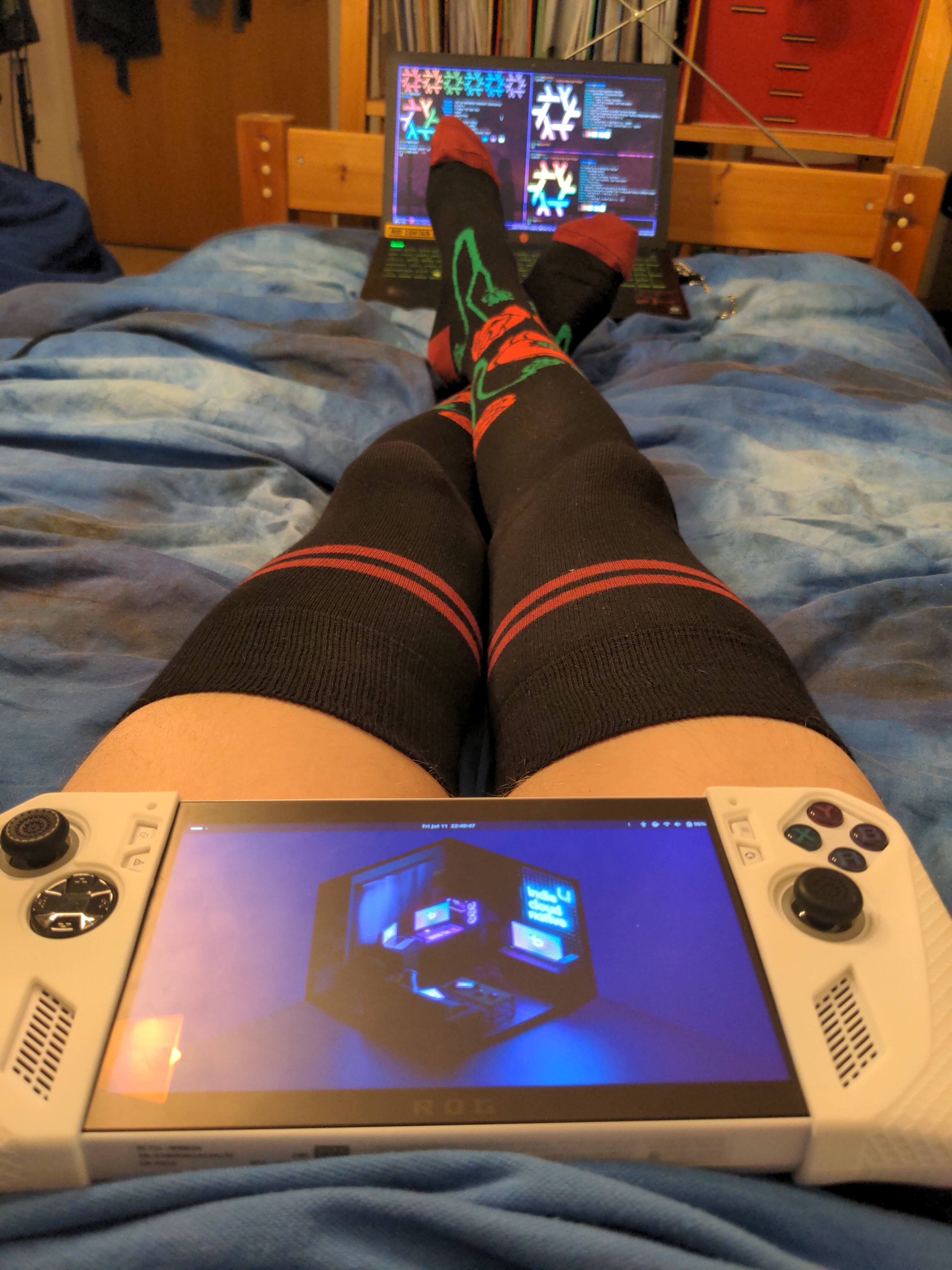 The same frame but my legs are now crossed. The gaming handheld has moved and is laying flat on my crotch.