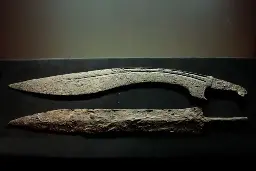 4th century BCE Spanish falcata sword, and later Roman gladius below